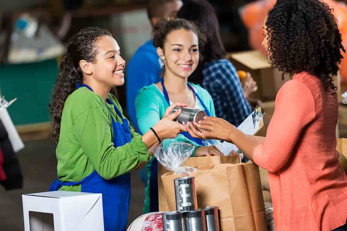 Woman donates canned goods to charity